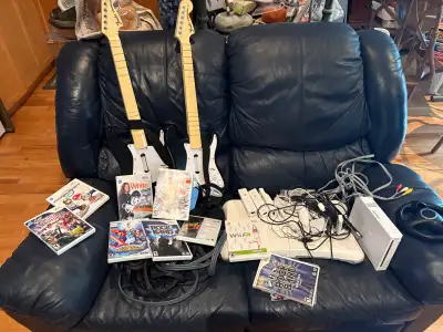 Wii with Wii fit and 2 guitars, View more