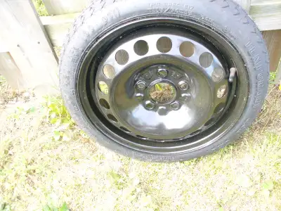 Compact spare tire. Never used. Standard five hole configuration. Goodyear brand. Selling for $20 ....
