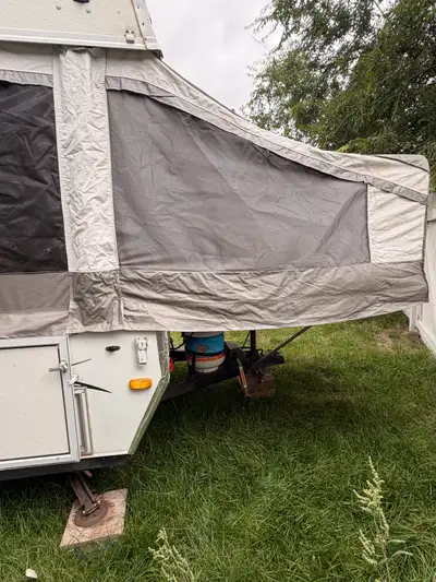 Spacious pop-up camper. Sleeps 4-6. Flooring and cushions are newer. Has a sink, fridge, and heater....