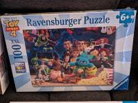 2 BRAND NEW PUZZLES.300 AND 100 PIECES