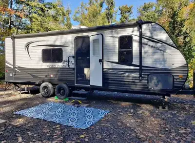 Meticulously maintained 26 foot Highland Ridge Open Range 26 BH travel trailer RV with double over d...