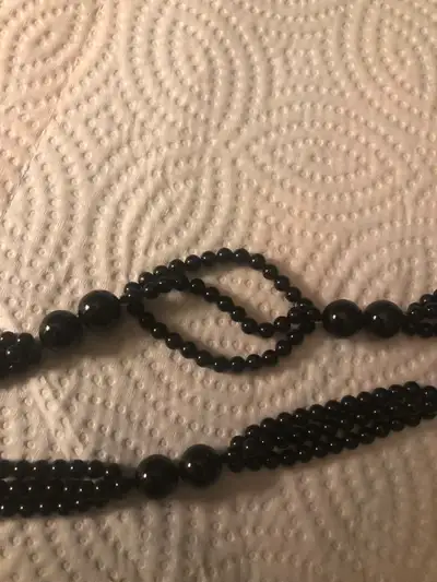 A beautiful 30” black Onyx bead three strand necklace in great condition