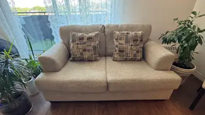 Two matching loveseats + four matching cushions , View more