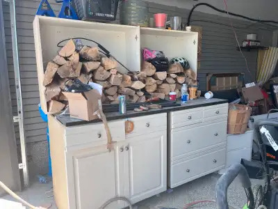 This is a used kitchen cabinet set, perfect for extra storage in a garage or workshop. The units fea...