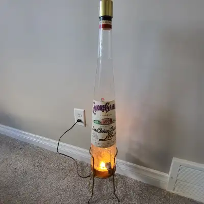 Vintage Liquore Galliano glass bottle on stand & working light, View more