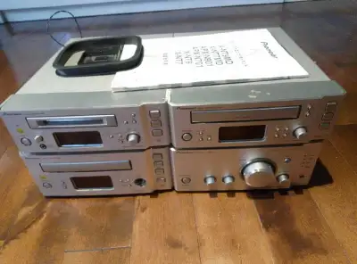 This Pioneer audio system features a CD player, tape deck, and amplifier for a complete audio experi...
