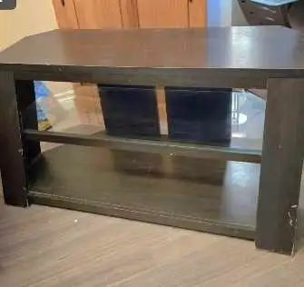 Solid, very sturdy. A few small marks but in otherwise great condition. 1 glass shelf, from a smoke...