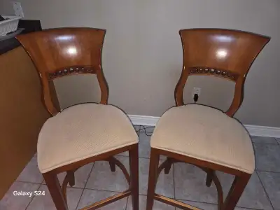 Add a touch of elegance to your kitchen or bar area with these used bar stools, featuring a sturdy w...