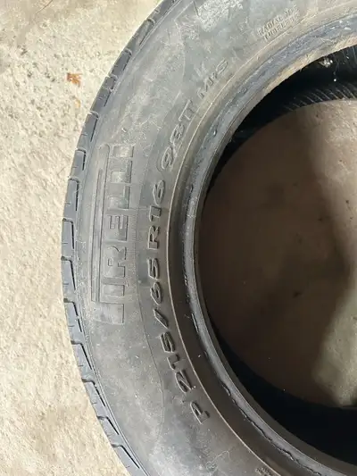 Pair of Pirelli 215/65R16 tires.
