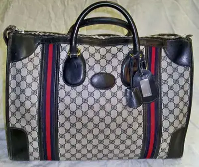 Authentic GUCCI Monogram Carry On Bag, View more