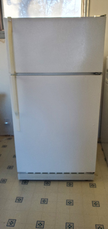 3 Fridges and a Microwave in Refrigerators in Saskatoon