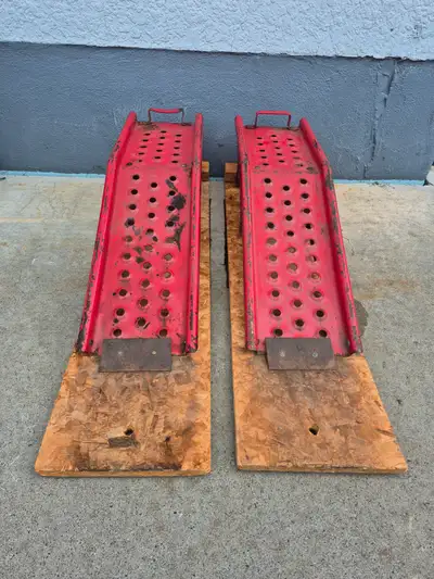FOR SALE HEAVY DUTY STEEL RAMPS MOUNTED ON ANTI SKID PLYWOOD BASE. ASKING $125.00 OR BEST OFFER. FOR...