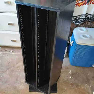 Looks brand new one This TWO sided rotating CD tower provides an efficient and space-saving solution...