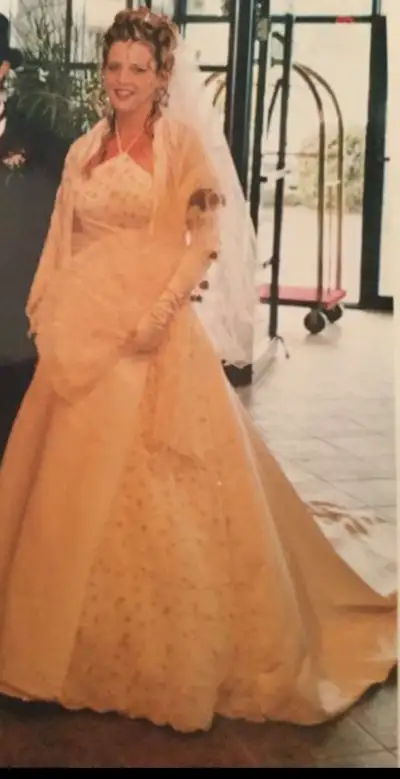Beautiful cream wedding dress. Size 12. Brand: Emme Bridal. Was worn with a crinoline wich I had ren...