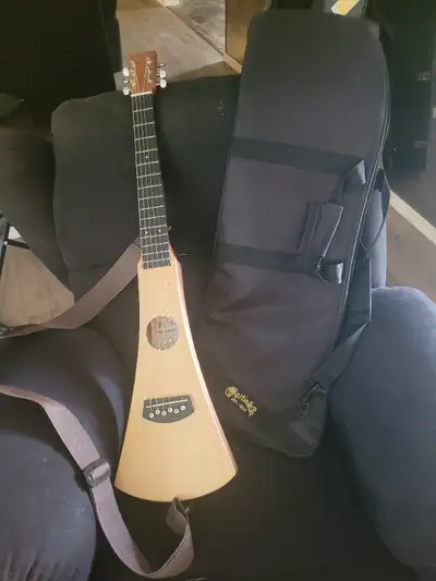Martin acoustic traveller guitar with strap and gig bag. Great for trips and camping.