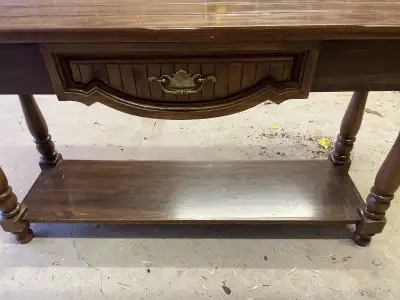 Solid wood Brown sofa table for sale. Measures 48”w x 15”d x 27”h. Comes from pet free and smoke fre...