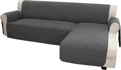 Selling a like-new dark grey reversible sectional sofa slipcover. Includes 1 cover and 6 foam strips...