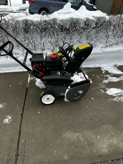 Keep your driveway clear this winter with this Troy-Bilt snow blower, featuring a reliable engine an...