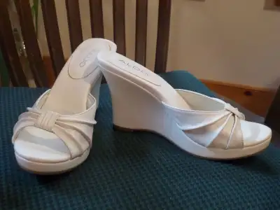 Beautiful white leather wedge slides make your feet look small Brand new, never worn From Aldo Make...