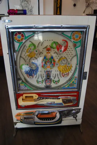 Step right up and try your luck with this vintage Pachinko machine! This Japanese arcade game is a d...