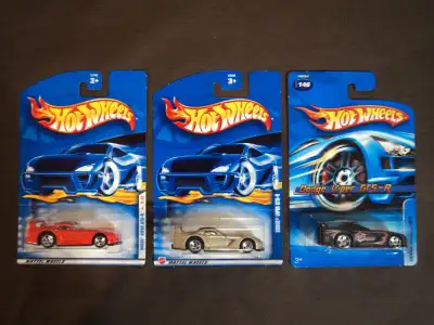 This lot includes a red (#23), light gold (#174), and black (#146) Dodge Viper GTS-R.