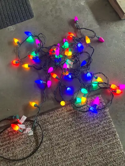 String of 50 lights. Large plastic cover. Electric with connectors at both ends. two extra covers an...