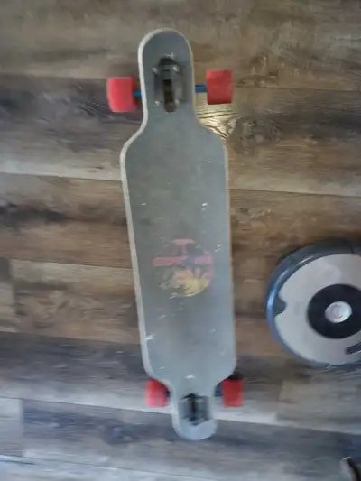 Cruise the streets with this rad Santa Cruz longboard! It's seen some action, so it has the scratche...