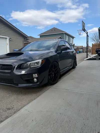 Selling my 2015 Subaru WRX sport tech, maintained by journeyman mechanic. Asking 14,000$ OBO no trad...