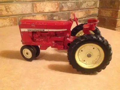 ANTIQUE INTERNATIONAL TOY  TRACTOR, View more