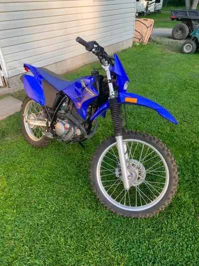 Selling because my wife never rode it. 2023 Yamaha TT-R230 trail bike, about 15 hours on it. 223cc a...