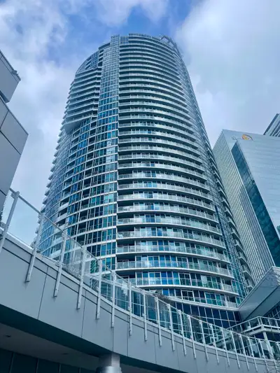 Bright high ceiling overlooking the lake, 1 bedroom South Tower Condo Suite at Waterclub Condos. Sit...