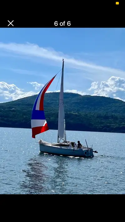Wing keel, tiller with extension , 6 hp 4 stroke, hank on… 2 jib 2 genoas, 1 main with reefing, asym...