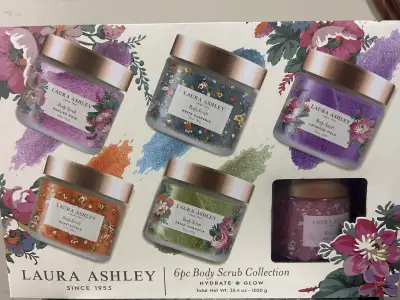 Brand new, unopened Laura Ashley "Hydrate & Glow" Body Scrub Collection. Includes six different flor...