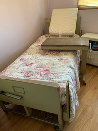 Hospital bed  and serving table