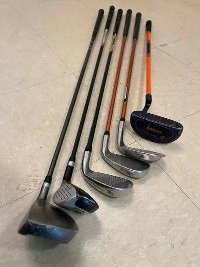 I'm selling a set of used golf clubs, perfect for kids or beginners. The set includes a driver, hybr...