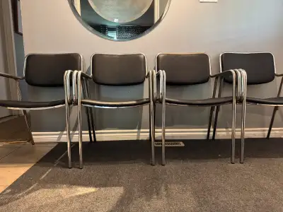 Postmodern set of 4 tubular steel chairs - newly upholstered in black vinyl - made in Canada by Glob...