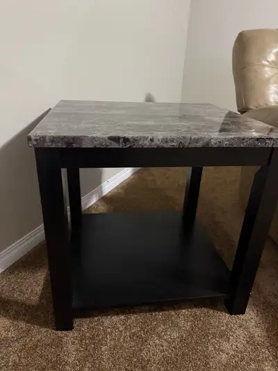 These end tables feature a stylish faux marble top and a sturdy dark wood frame, perfect for adding...