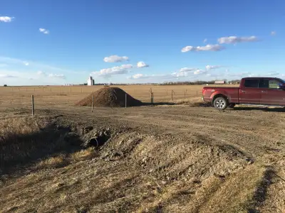 5 acres on highway 18 at grid road to Outram. Large approach,live electricity with rv plugs fenced.