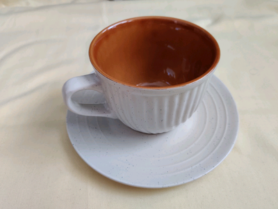 Stoneware cup and saucer set , View more