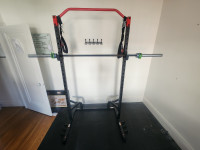 Almost new Squat Rack & 45lb Barbell (w/safety clamps)