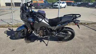 Like new, only 5400kms on it. Tires are upgraded from stock. Engine guards and Honda tank bag includ...