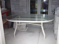 Like new glass and metal patio table ideal for out side use