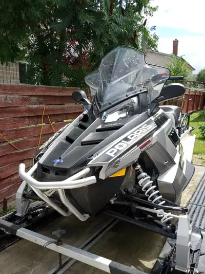 550 Polaris fan cooled Utility sled. Electric start, reverse, hand warmers 2 new belts, 4 new plugs....