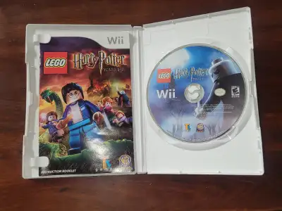 Wii Harry Potter Lego game. Nice shape. $30.00 Wii remotes white $25.00 Wii motion remote black with...