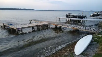 I have a large used wooden dock for sale, in the shape of the number "4". It consists of 8 separate...