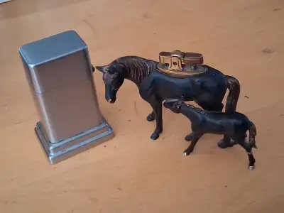 100 the pair or take the Zippo for 80 or the Horse And Foal for 30. Both are going to need flints an...
