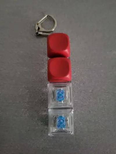 Add a bit of fidget fun to your day with this clicky mechanical keyboard switch keychain. This used...