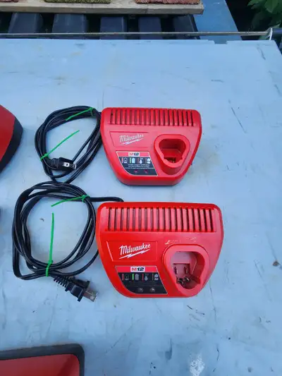 For sale five Milwaukee Tool 12V M12 Lithium-Ion Battery Chargers. Model # 48-59-2401 Store SKU # 10...