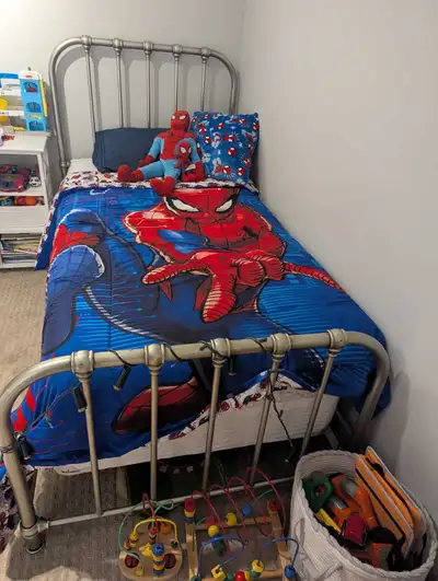 Metal twin bed frame with newer Costco mattress and box spring, View more