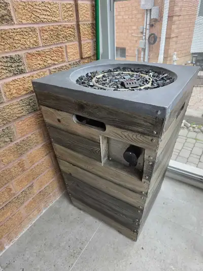 This Sandpoint fire column features a faux wood design crafted from a durable concrete-based composi...